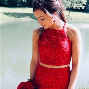 It has been hemmed. She is 5’4